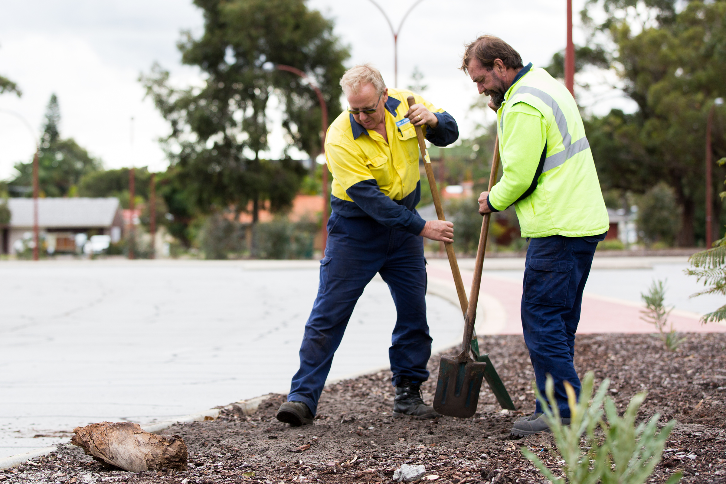 Two men work in a park