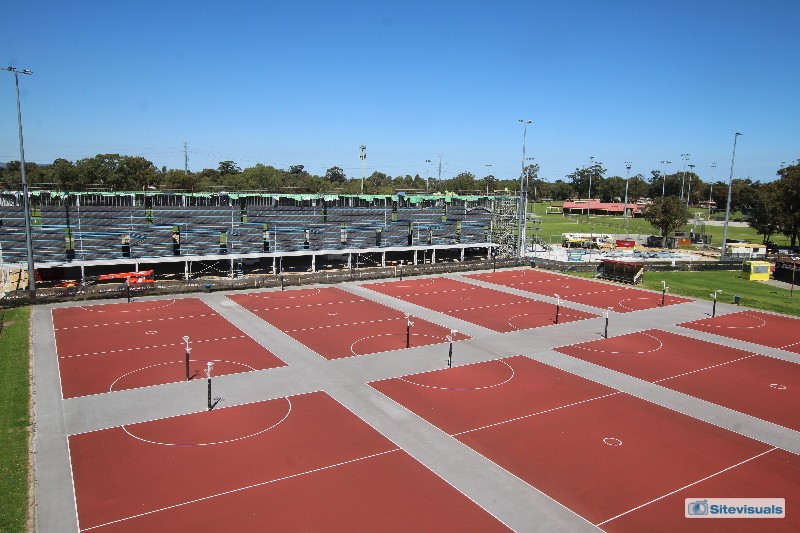 Steel structure behind outdoor netball courts