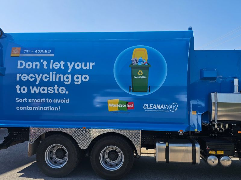 Blue truck with "Don't let your recycling go to waste" message