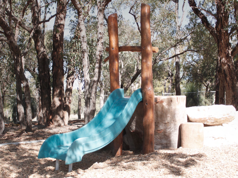 Green slide from wooden frame