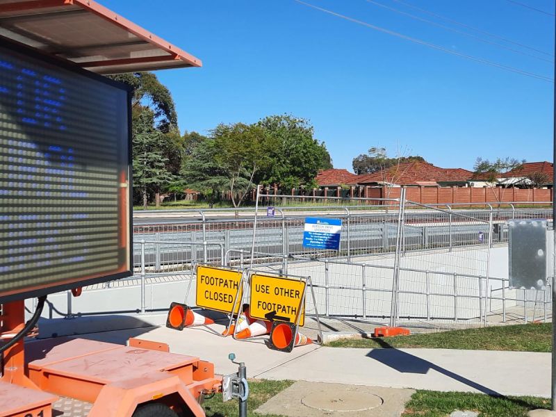 Variable message sign, temporary fencing in front of underpass
