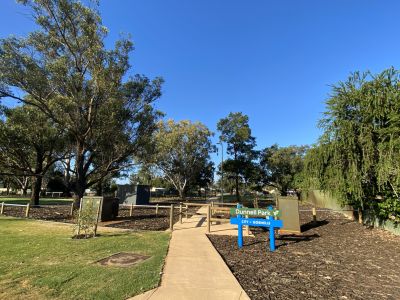 Path to park with new park sign